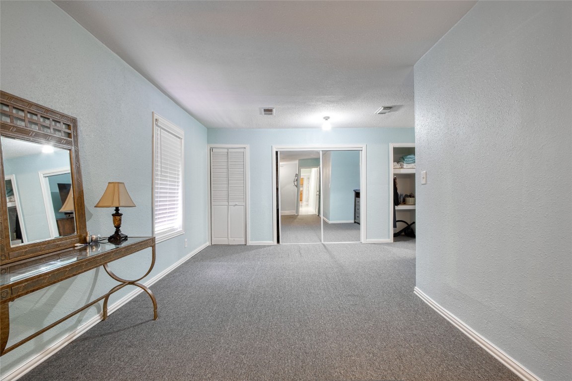 13117 Player Street Houston, TX 77045 - Photo 13 of 36 a view of empty room with wooden floor and windows