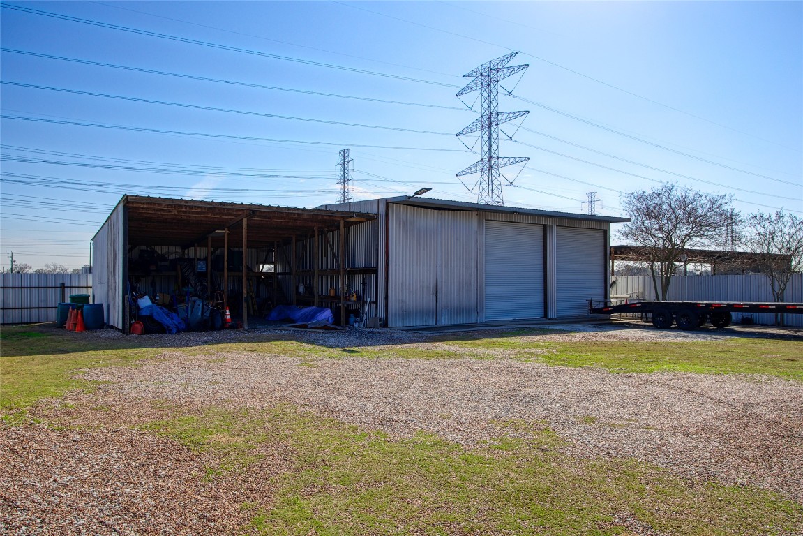 13117 Player Street Houston, TX 77045 - Photo 24 of 36 a view of a house with swimming pool and a yard
