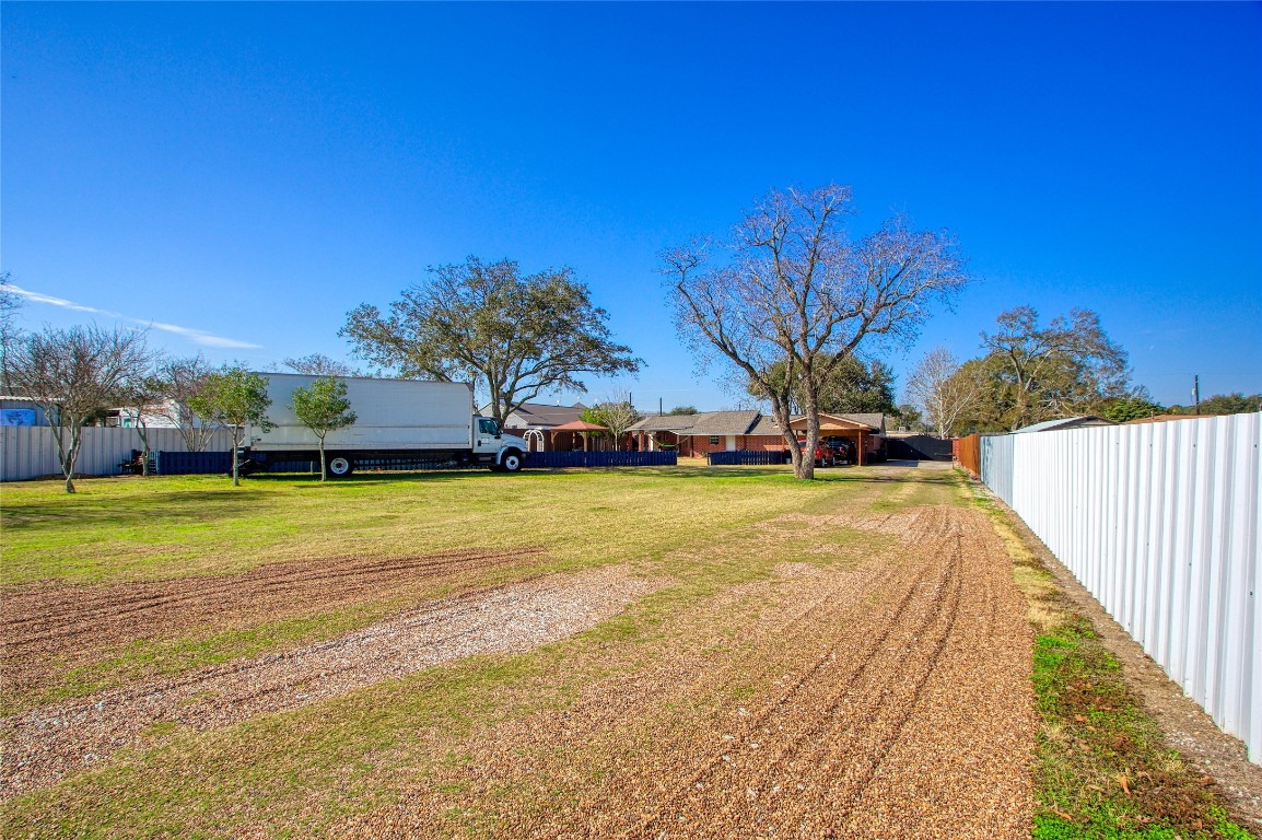 13117 Player Street Houston, TX 77045 - Photo 25 of 36 a view of swimming pool and trees in the background