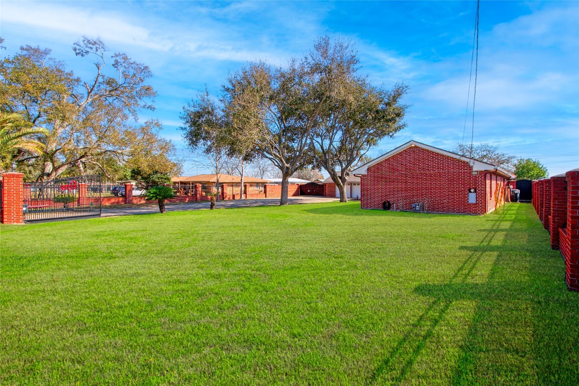 13117 Player Street Houston, TX 77045 - Photo 36 of 36 a view of a house with a big yard
