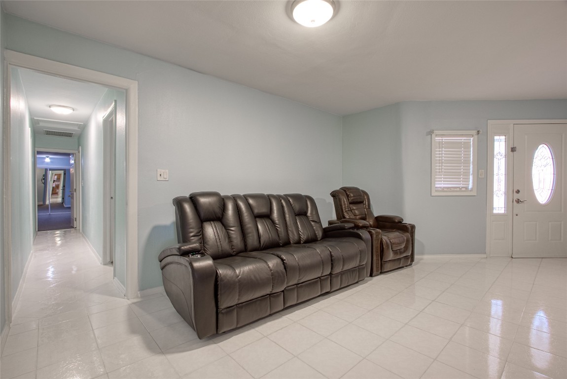 13117 Player Street Houston, TX 77045 - Photo 7 of 36 a living room with couches and a fireplace