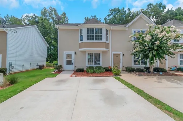 front view of a house with a yard
