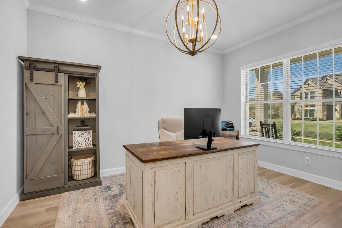32442 Soaring Willow Way Conroe, TX 77385 - Photo 22 of 45 a view of a workspace with furniture and a window