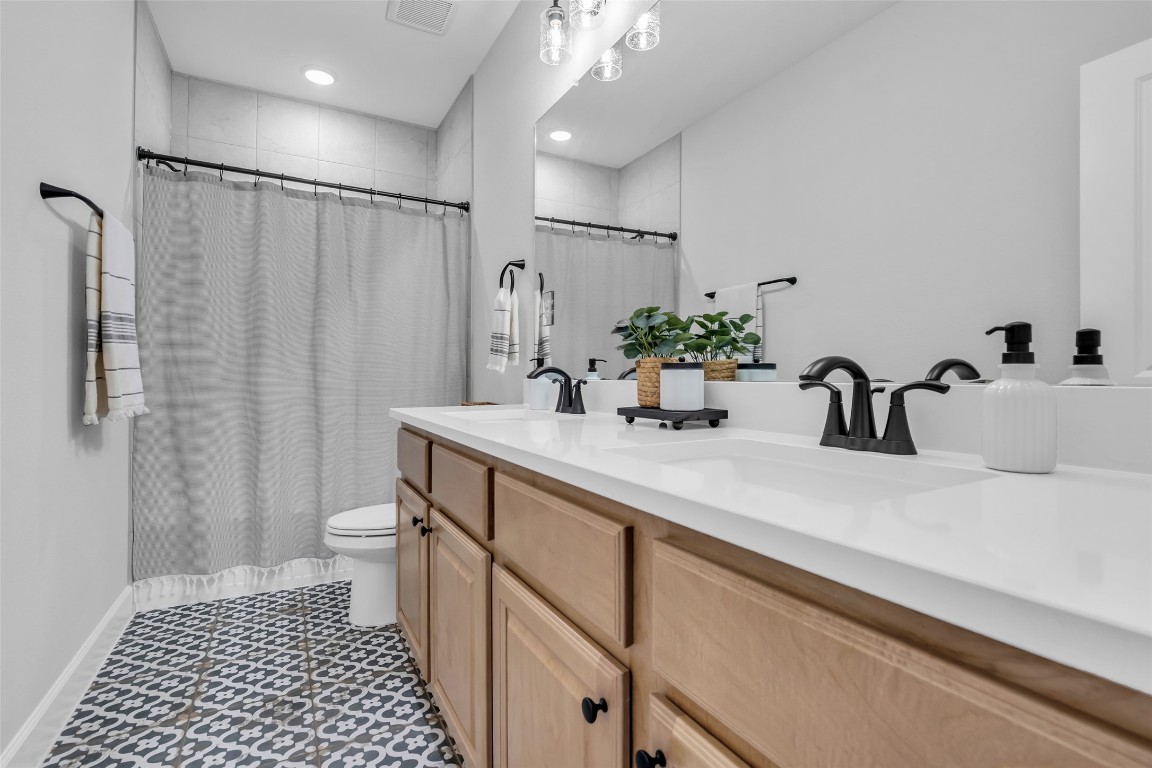 32442 Soaring Willow Way Conroe, TX 77385 - Photo 29 of 45 a bathroom with a sink a toilet and shower
