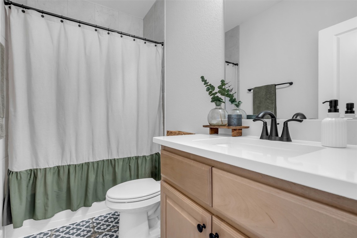 32442 Soaring Willow Way Conroe, TX 77385 - Photo 30 of 45 a bathroom with a sink a toilet and a mirror
