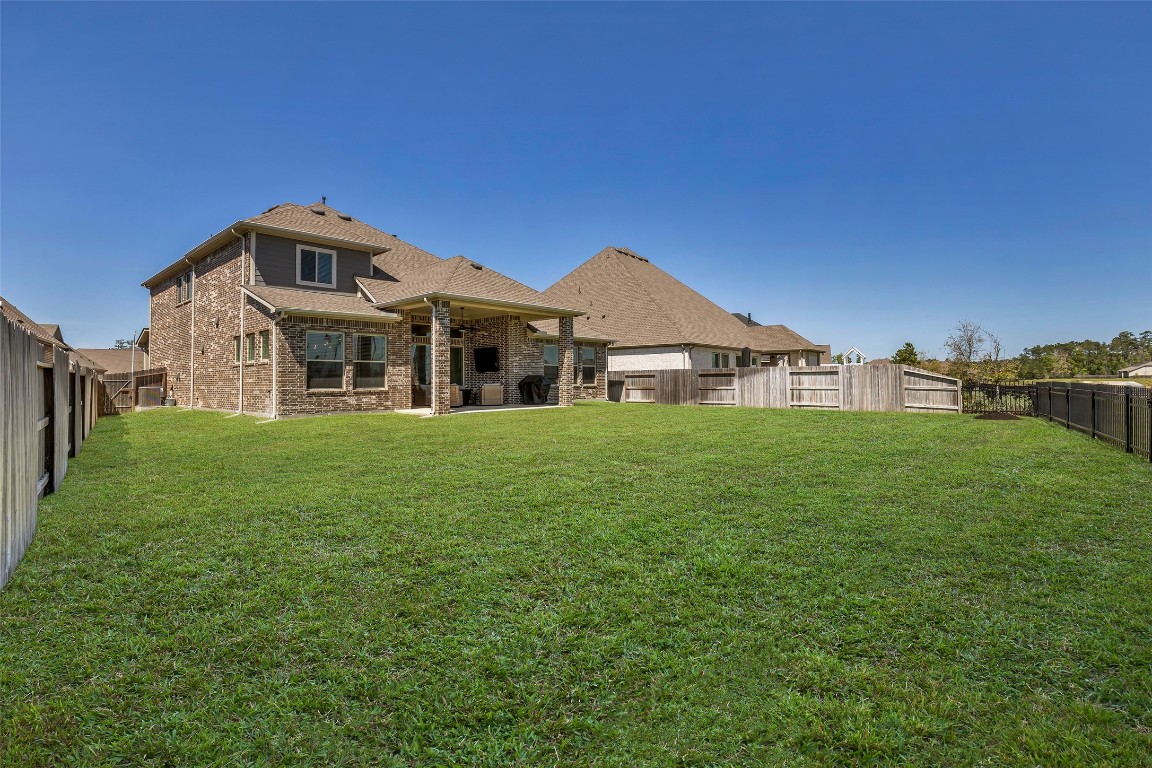 32442 Soaring Willow Way Conroe, TX 77385 - Photo 37 of 45 a front view of a house with garden