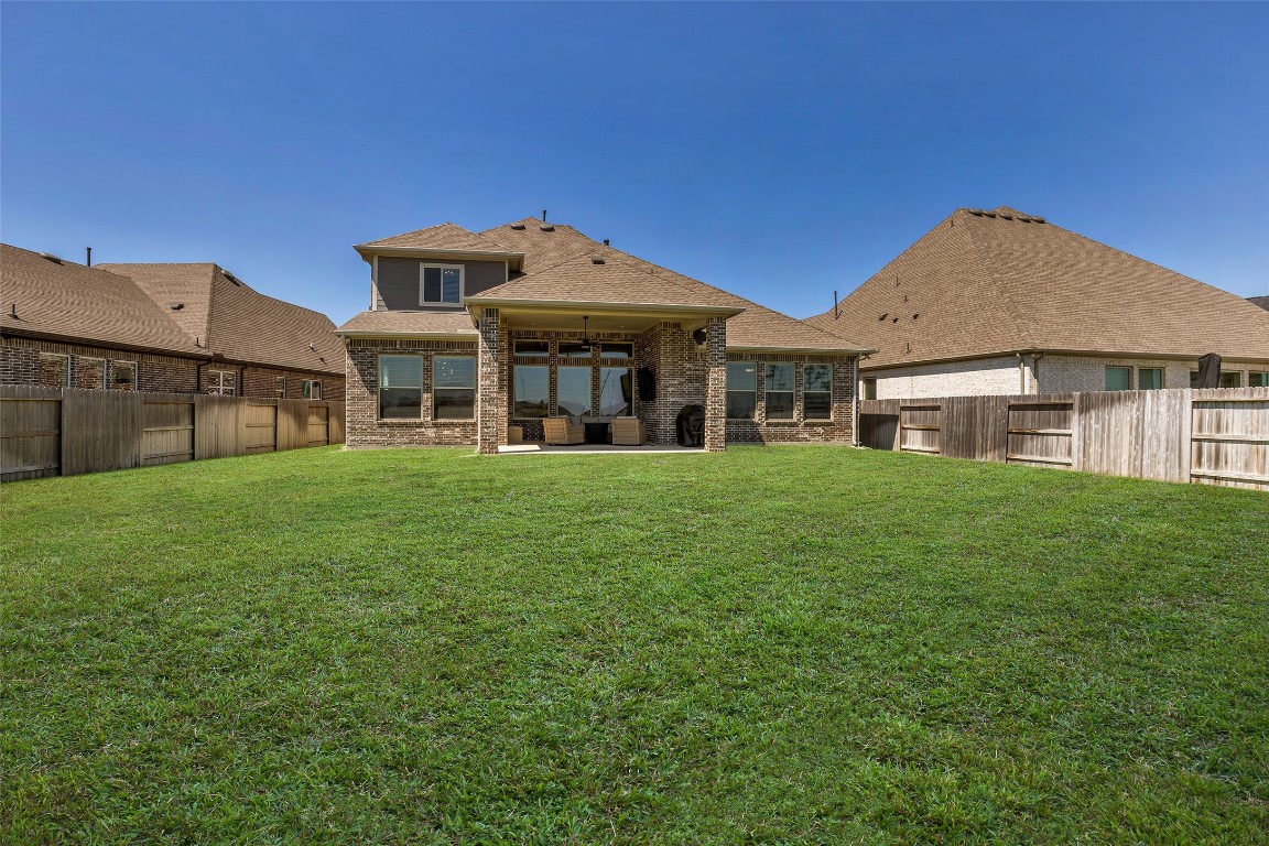 32442 Soaring Willow Way Conroe, TX 77385 - Photo 38 of 45 a front view of a house with a garden