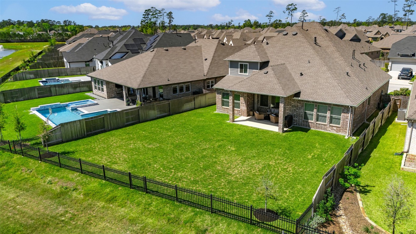 32442 Soaring Willow Way Conroe, TX 77385 - Photo 42 of 45 an aerial view of a house with swimming pool garden and mountain view in back