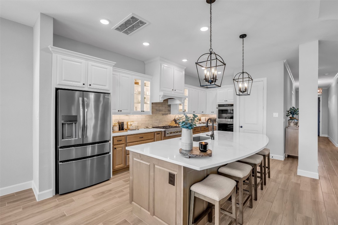 32442 Soaring Willow Way Conroe, TX 77385 - Photo 8 of 45 Oversized island with seating, ideal for gathering, meal prep, and casual dining.