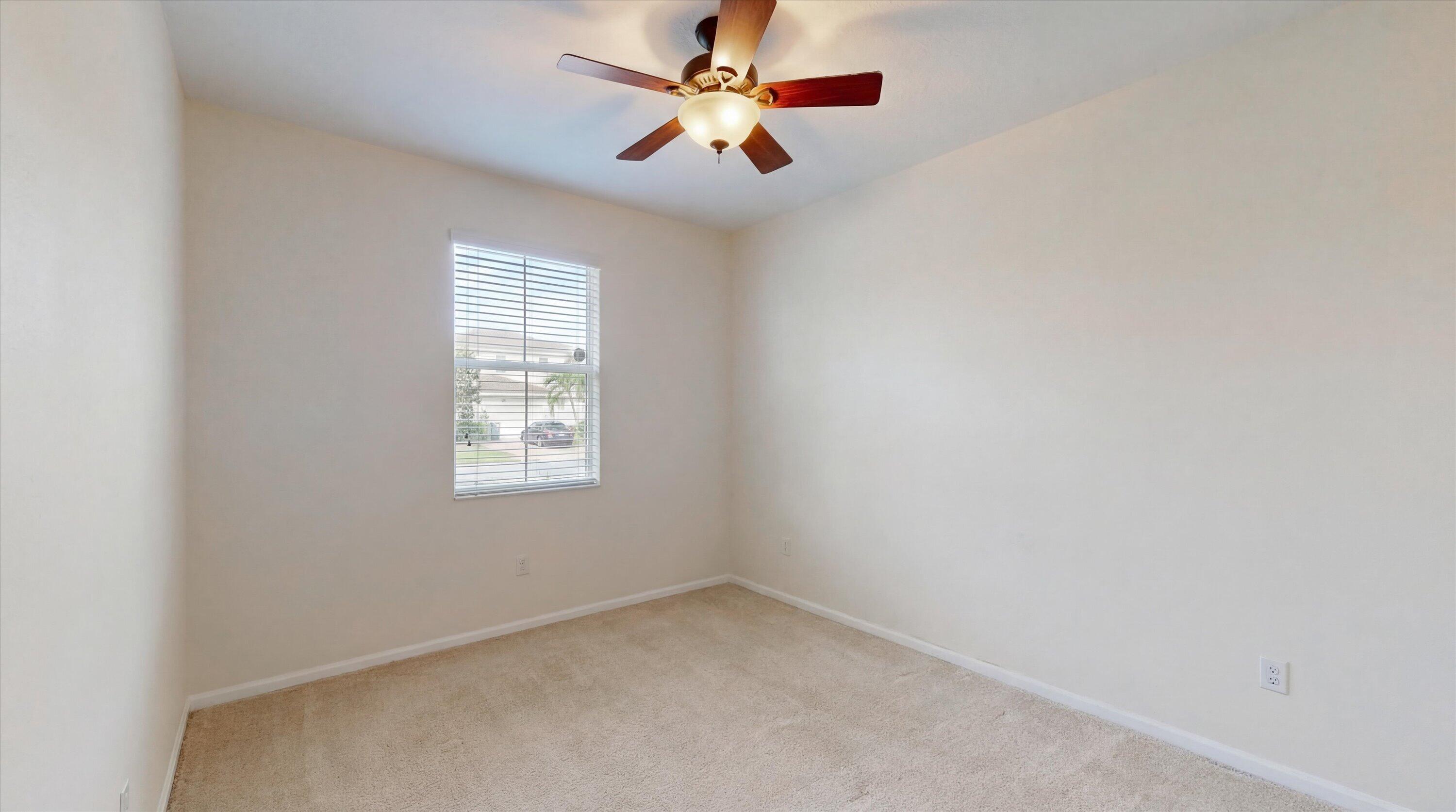 3072 Payson Way Wellington, FL 33414 - Photo 28 of 43 an empty room with a window and a fan