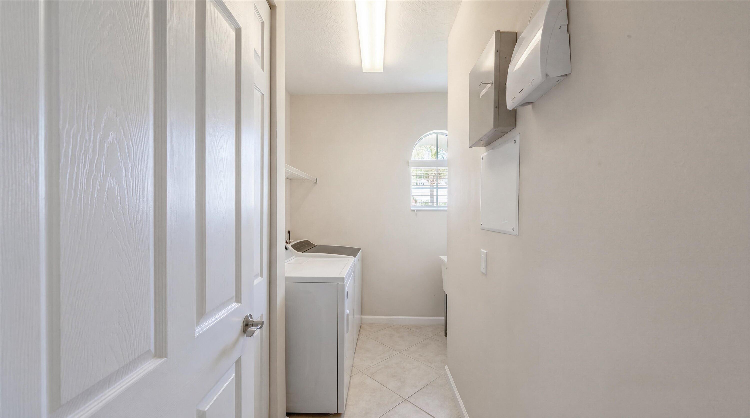 3072 Payson Way Wellington, FL 33414 - Photo 29 of 43 a view of an entryway with wooden floor