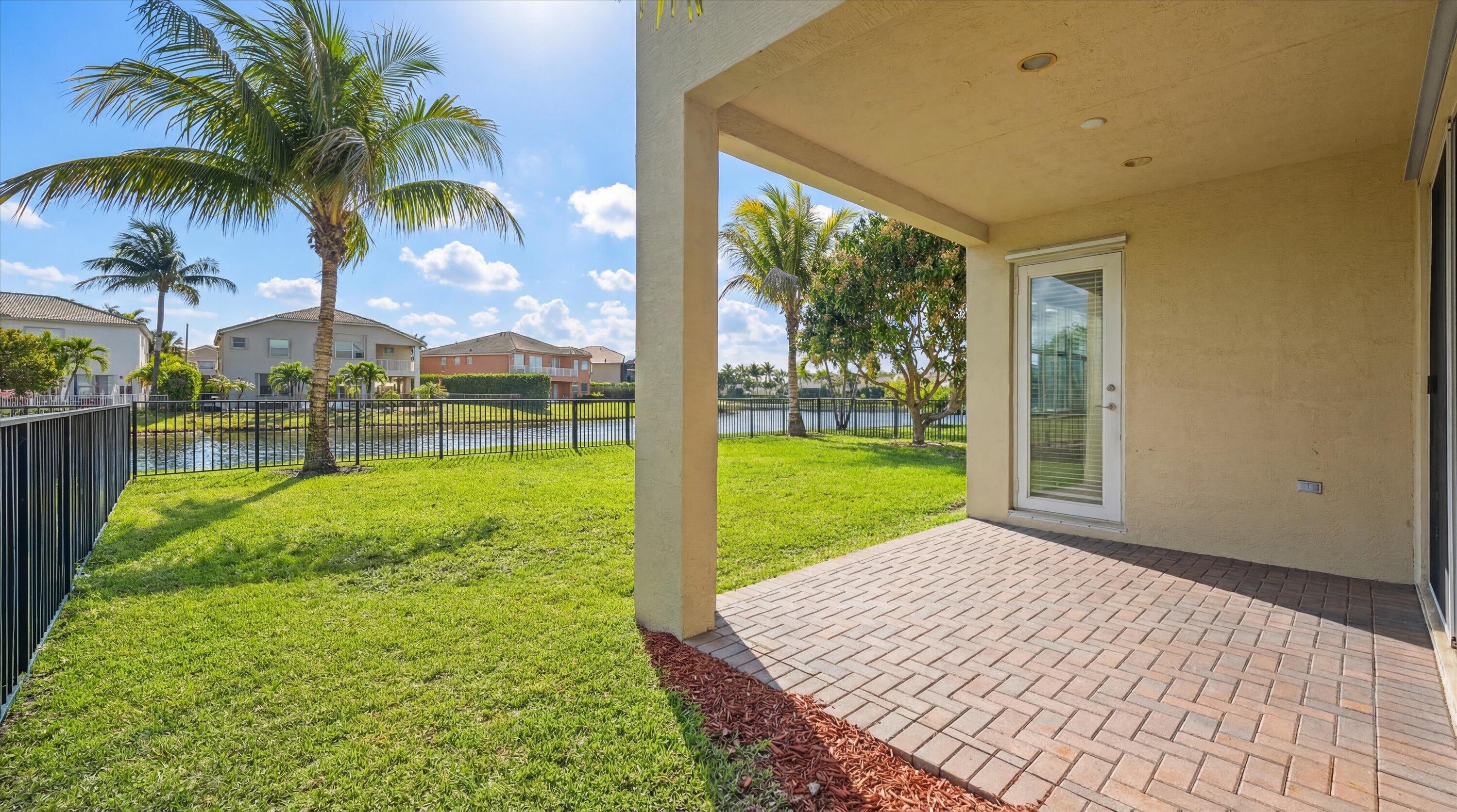 3072 Payson Way Wellington, FL 33414 - Photo 30 of 43 a view of a backyard with garden