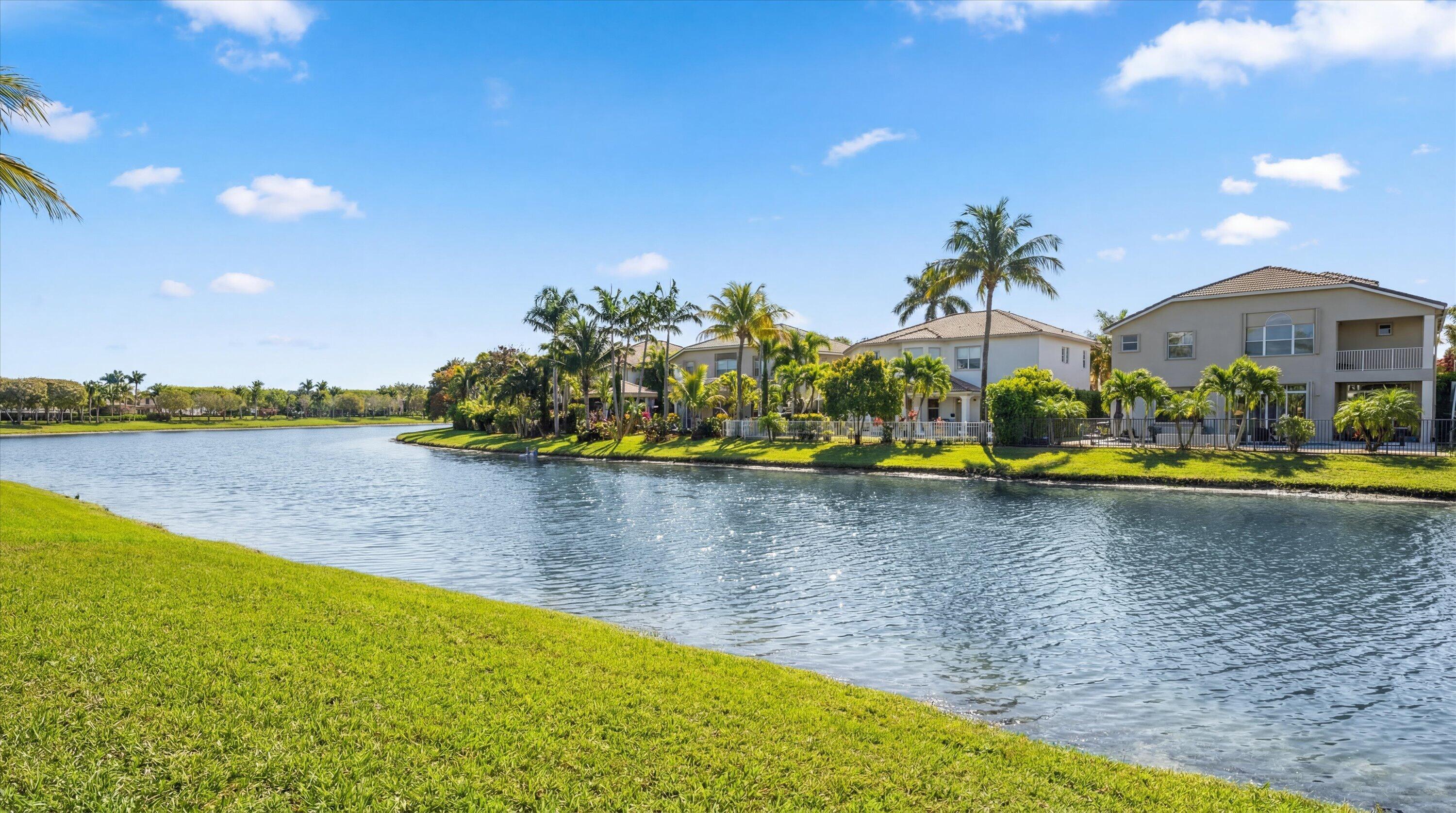 3072 Payson Way Wellington, FL 33414 - Photo 36 of 43 a view of a swimming pool with an outdoor space and seating area