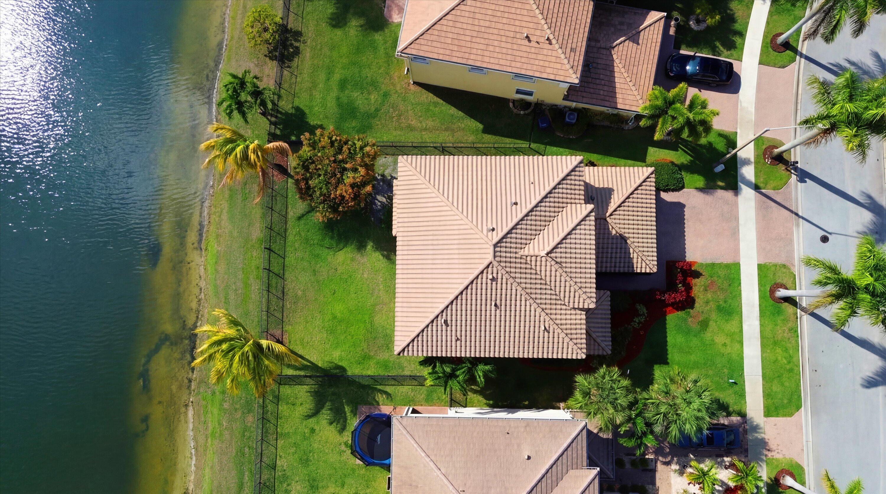 3072 Payson Way Wellington, FL 33414 - Photo 41 of 43 an aerial view of a house with a yard and potted plants