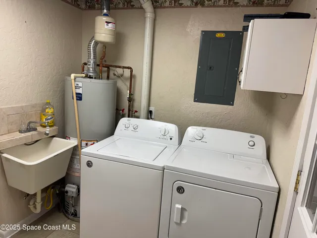 a bathroom with a sink toilet and a mirror