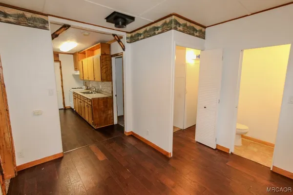 a view of a room with wooden floor and balcony