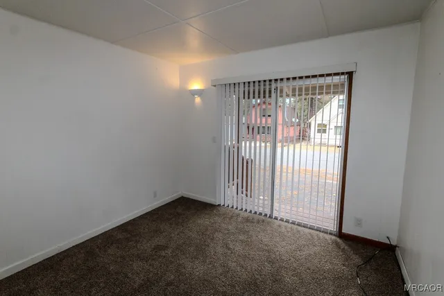 an empty room with sliding door
