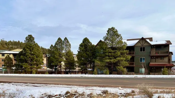 a view of a street in front of a building