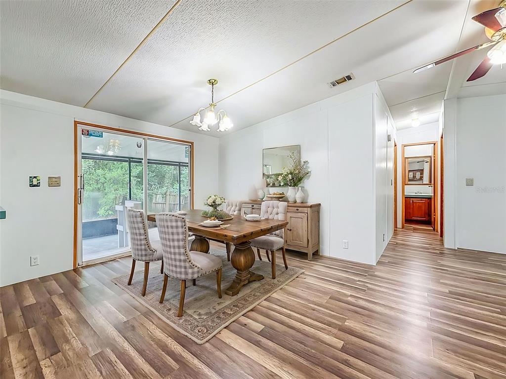 1819 Sinclair Hills Road Lutz, FL 33549 - Photo 22 of 60 a view of a dining room with furniture window and wooden floor