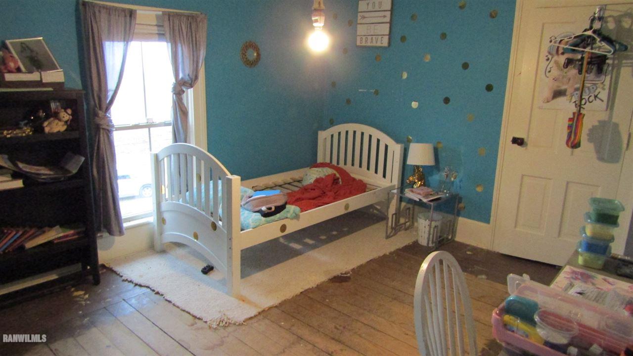 11693 Maple Grove Road Lanark, IL 61046 - Photo 12 of 19 a bedroom with furniture and a window