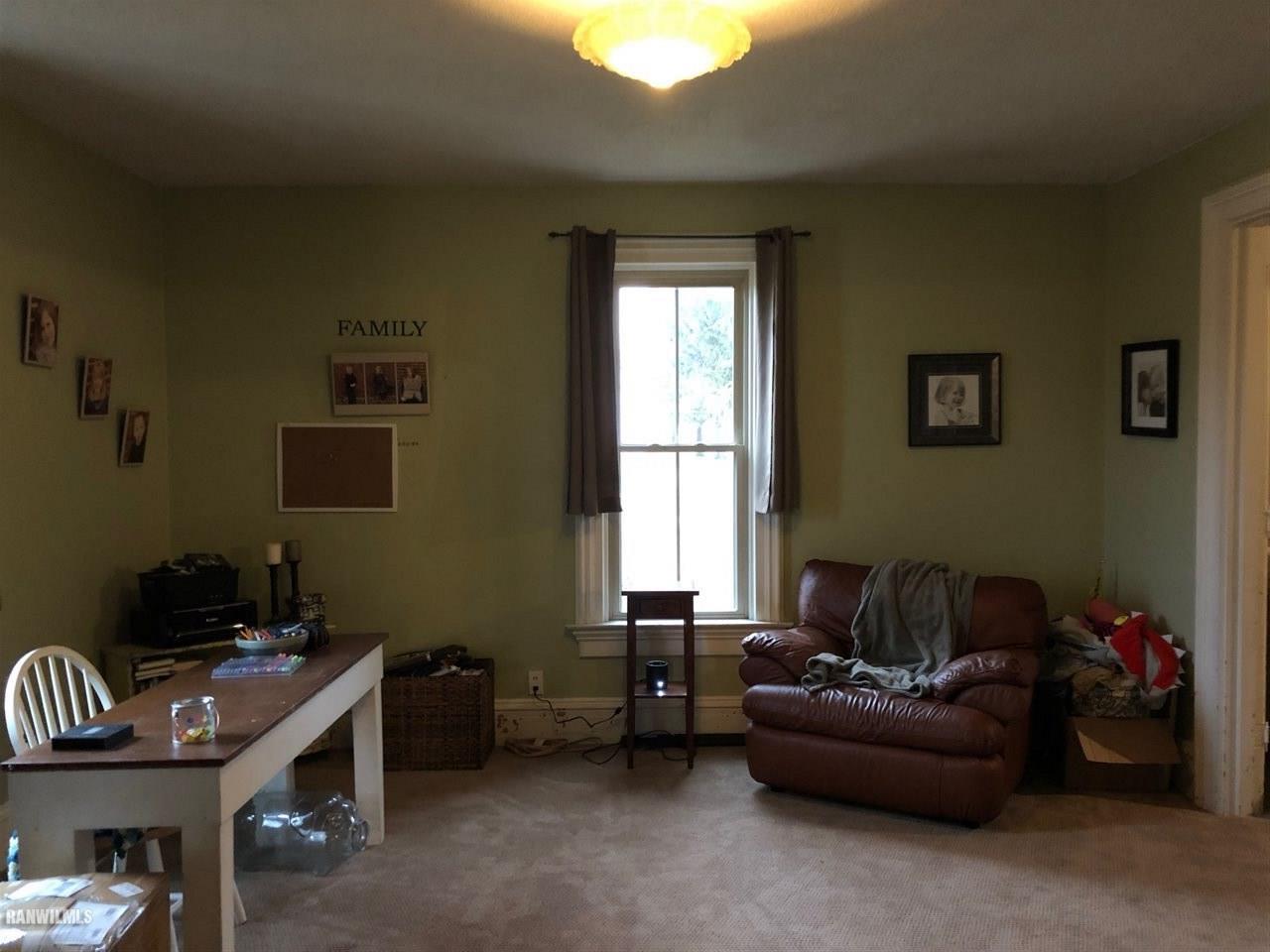 11693 Maple Grove Road Lanark, IL 61046 - Photo 6 of 19 a living room with furniture and a window