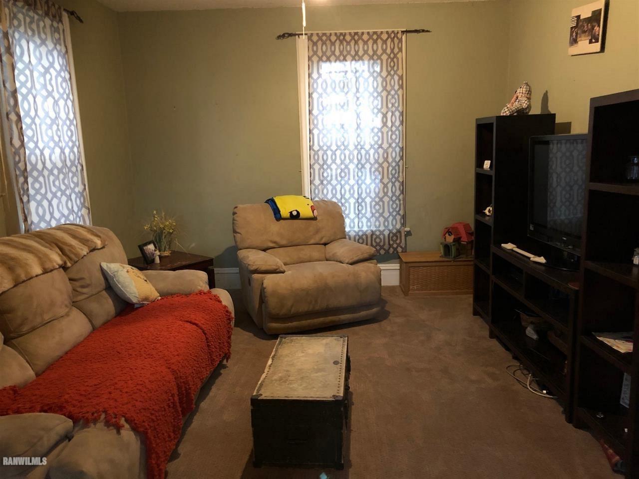 11693 Maple Grove Road Lanark, IL 61046 - Photo 7 of 19 a living room with furniture and a flat screen tv