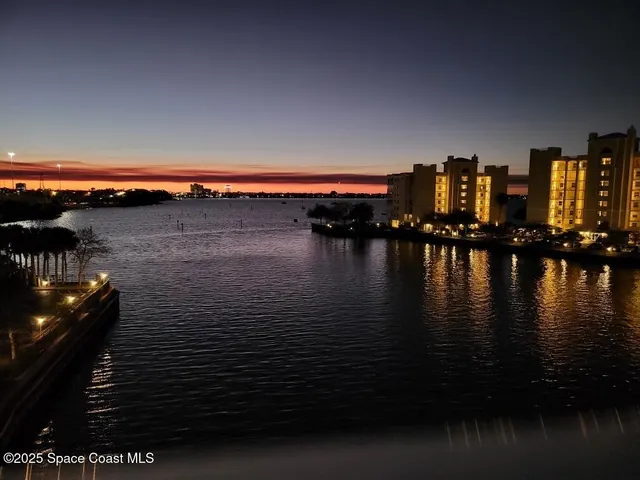 a view of building with outdoor space and sitting area