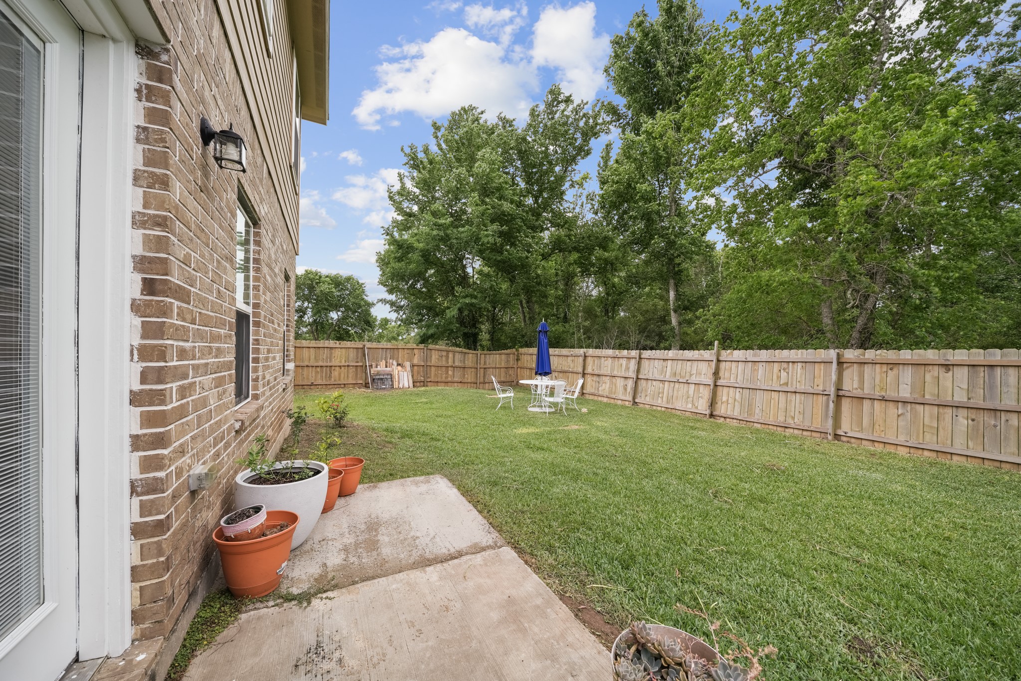 6101 Fox Ridge Drive Angleton, TX 77515 - Photo 27 of 30 a view of a backyard with sitting area