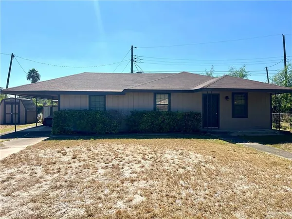 a house with yard in front of it