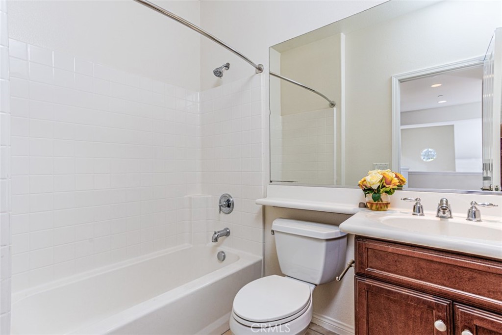 1401 Juliette Way Tustin, CA 92782 - Photo 18 of 27 a bathroom with a sink a toilet and shower