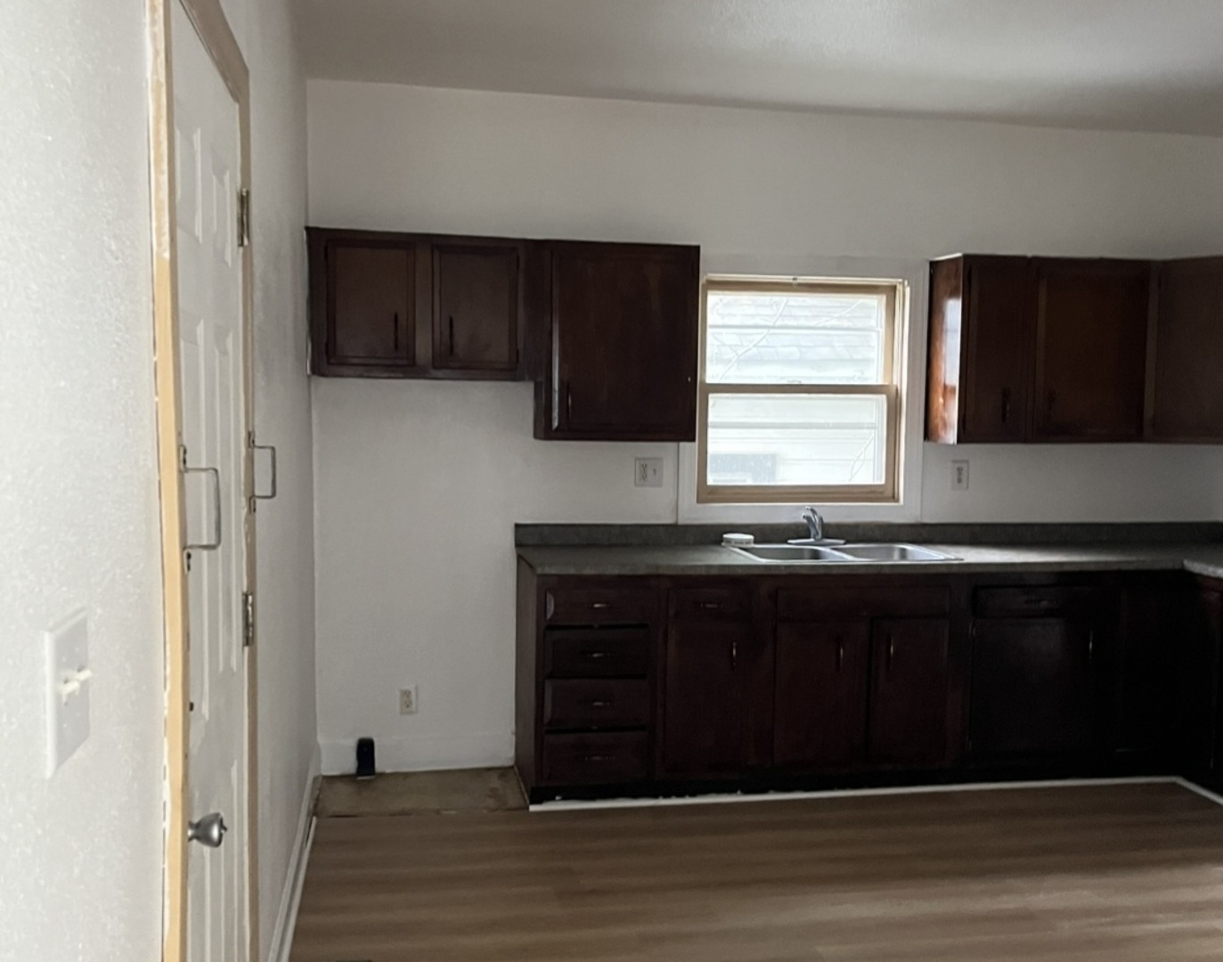 110-112 East Frank Street Freeport, IL 61032 - Photo 15 of 15 a kitchen with a sink and a window
