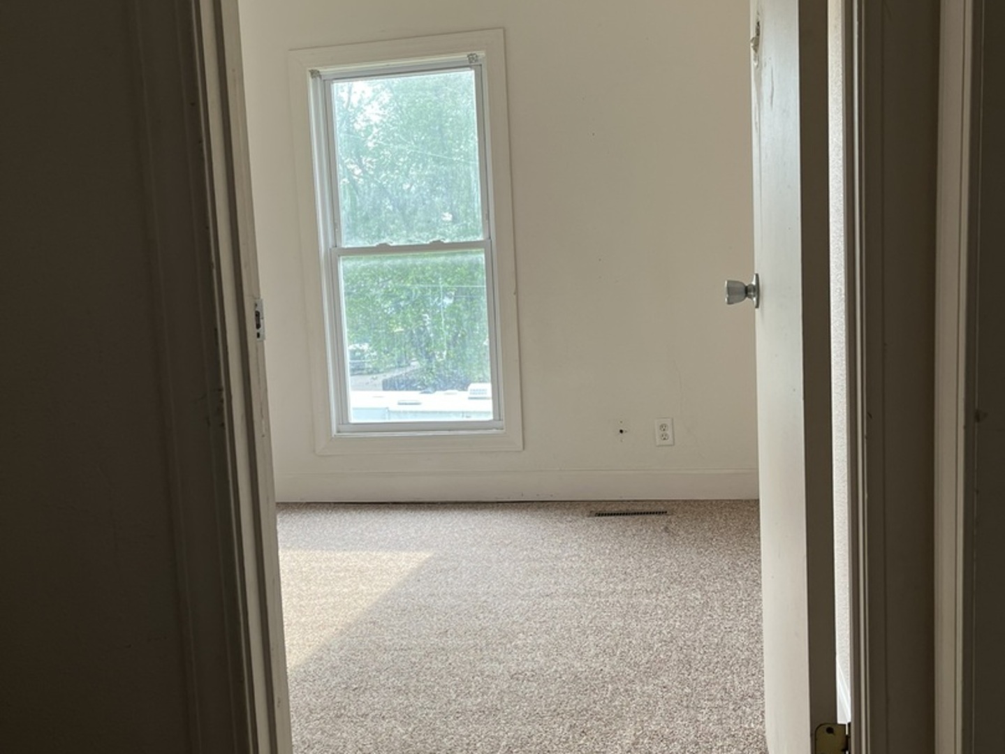 110-112 East Frank Street Freeport, IL 61032 - Photo 4 of 15 a view of an empty room with a window