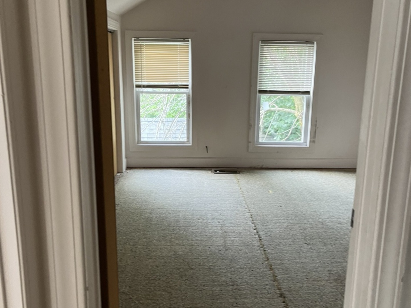 110-112 East Frank Street Freeport, IL 61032 - Photo 8 of 15 a view of an empty room with a window