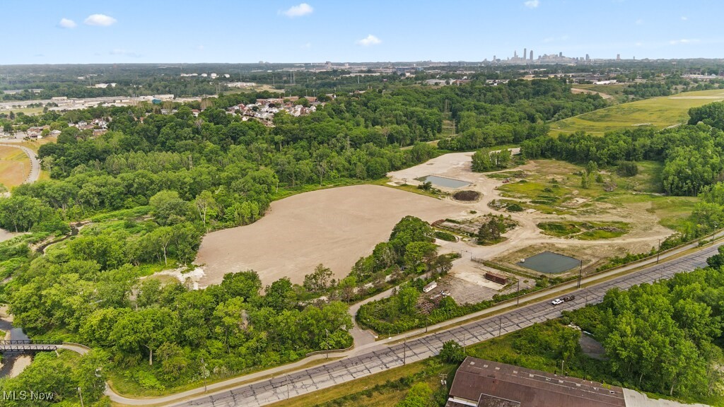 5000 Warner Road Garfield Heights, OH 44125 - Photo 20 of 41 Aerial view of property's location with a tree filled landscape