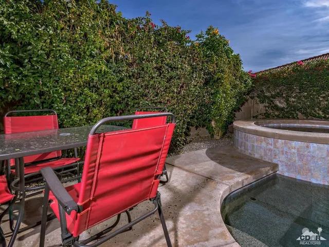 a backyard of a house with outdoor seating