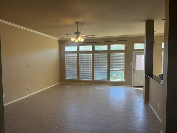 a view of an empty room with a window