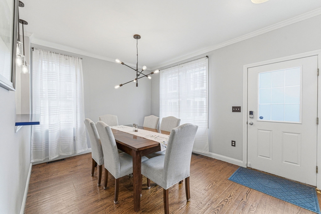 6 Millmont Street, Unit 6 Boston, MA 02119 - Photo 14 of 42 a view of a dining room with furniture window and wooden floor