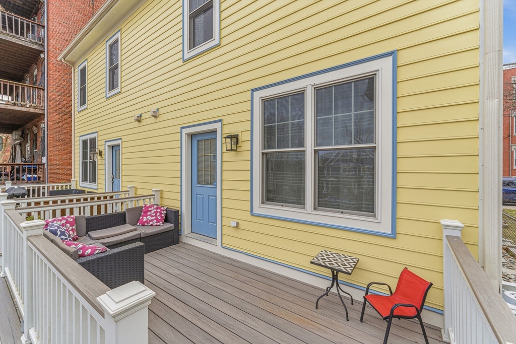 6 Millmont Street, Unit 6 Boston, MA 02119 - Photo 3 of 42 a building outdoor space with seating space