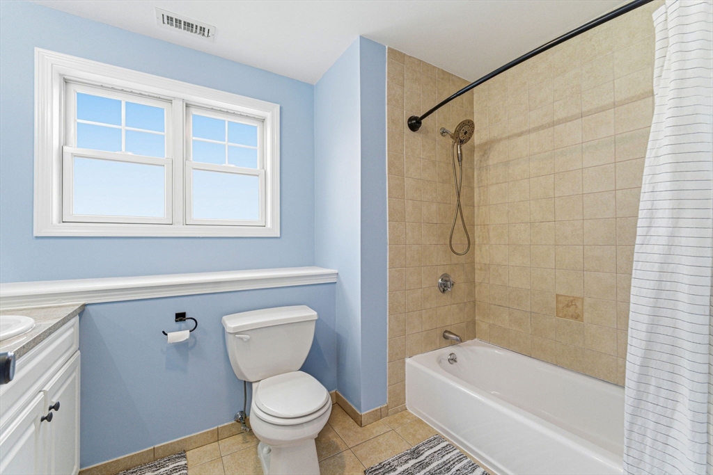 6 Millmont Street, Unit 6 Boston, MA 02119 - Photo 31 of 42 a bathroom with a toilet and a bathtub