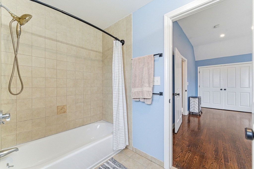 6 Millmont Street, Unit 6 Boston, MA 02119 - Photo 32 of 42 a bathroom with a bathtub and a shower