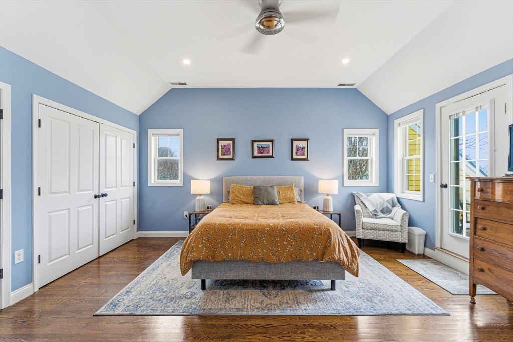6 Millmont Street, Unit 6 Boston, MA 02119 - Photo 34 of 42 a bedroom with a bed and wooden floor