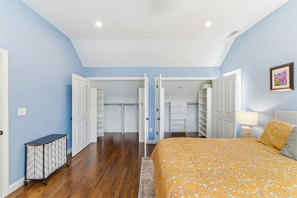 6 Millmont Street, Unit 6 Boston, MA 02119 - Photo 36 of 42 a bedroom with a bed and wooden floor