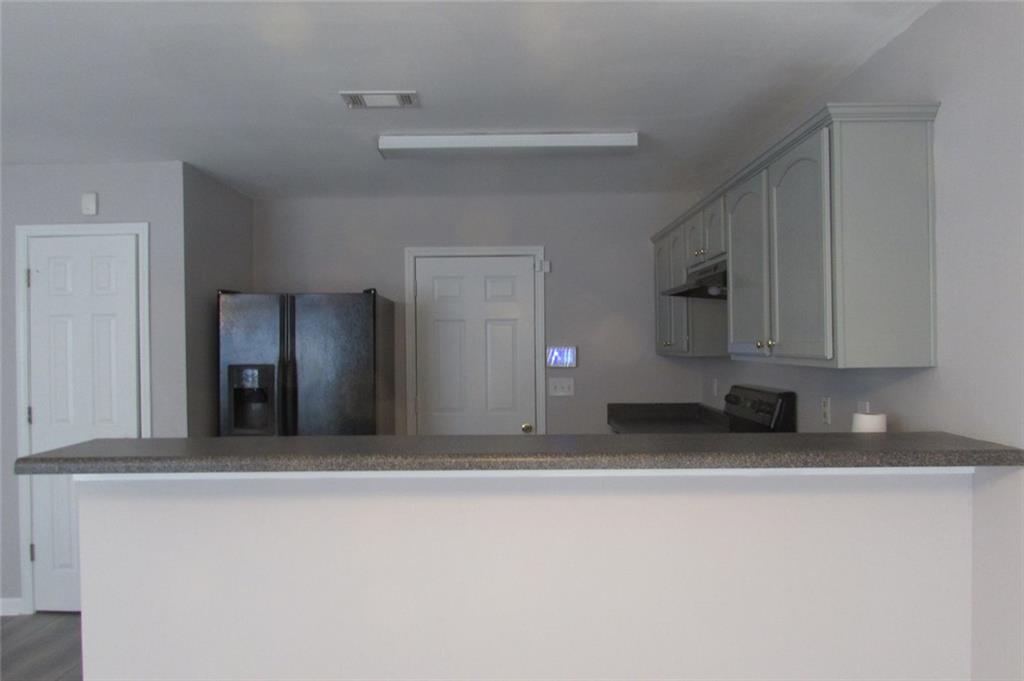 7238 April Court Morrow, GA 30260 - Photo 4 of 11 a view of a kitchen with a sink and cabinets