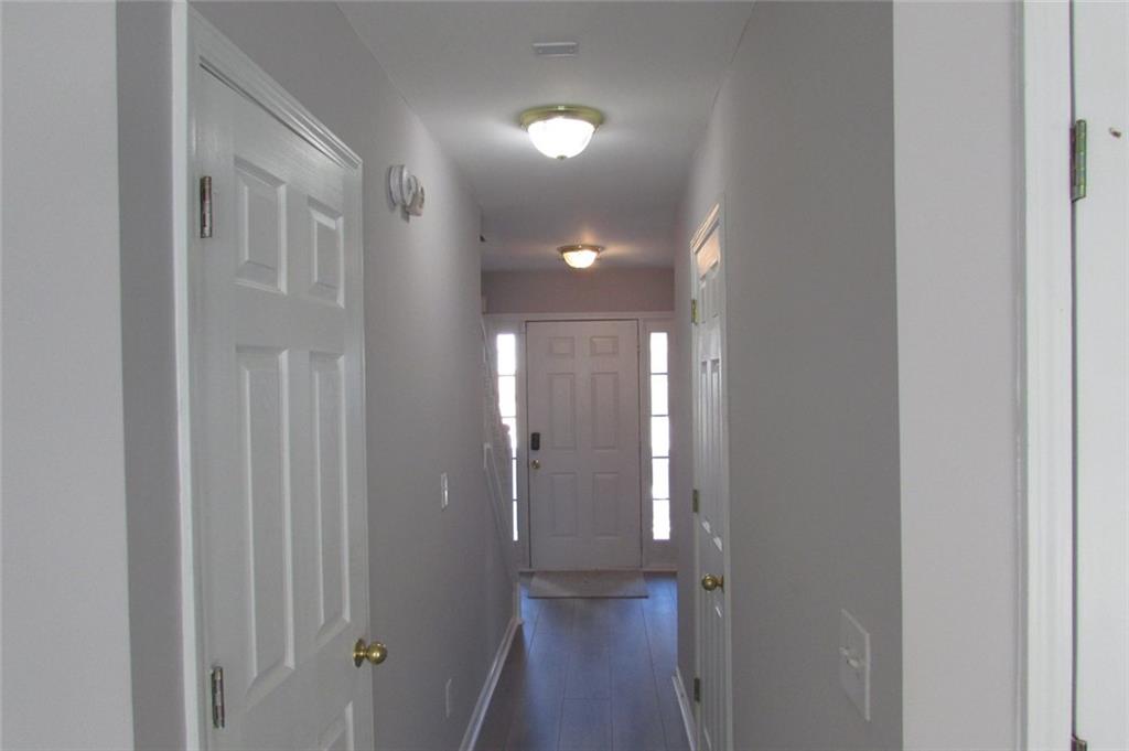 7238 April Court Morrow, GA 30260 - Photo 6 of 11 a view of a hallway with wooden floor
