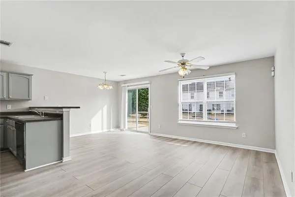 a view of a kitchen with marble kitchen and front door