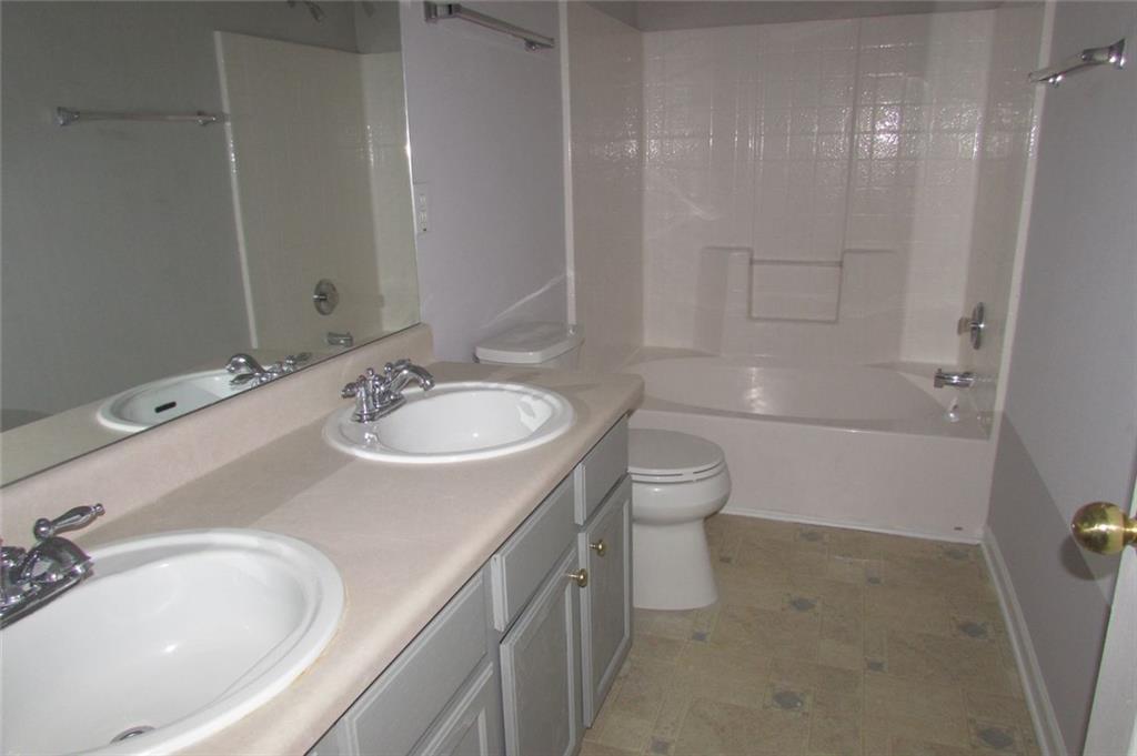 7238 April Court Morrow, GA 30260 - Photo 9 of 11 a bathroom with a sink toilet and shower