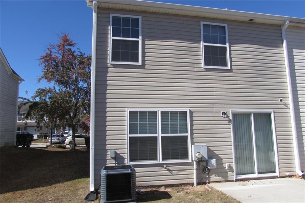 7238 April Court Morrow, GA 30260 - Photo 10 of 11 a view of a house with a yard