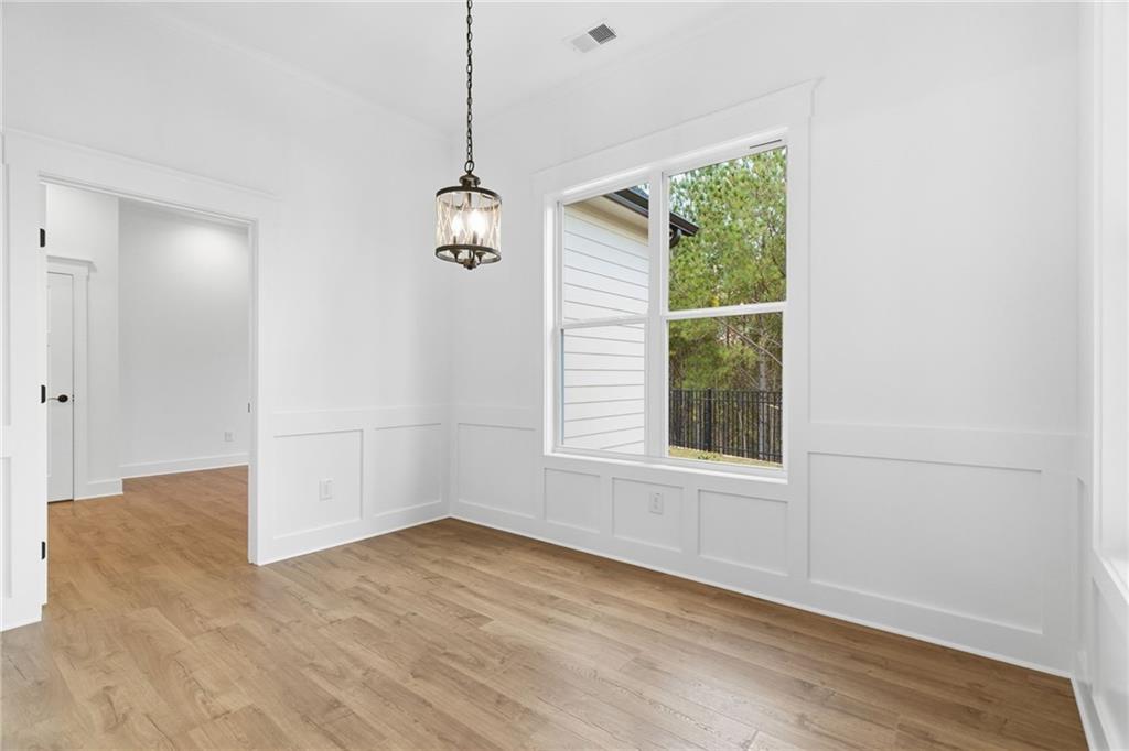 170 Field Stone Circle Jasper, GA 30143 - Photo 12 of 34 a view of empty room with wooden floor and fan