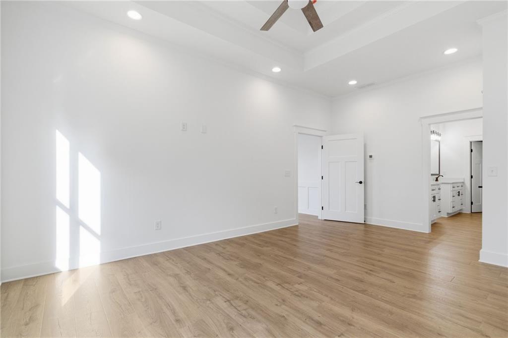 170 Field Stone Circle Jasper, GA 30143 - Photo 16 of 34 an empty room with wooden floor and windows