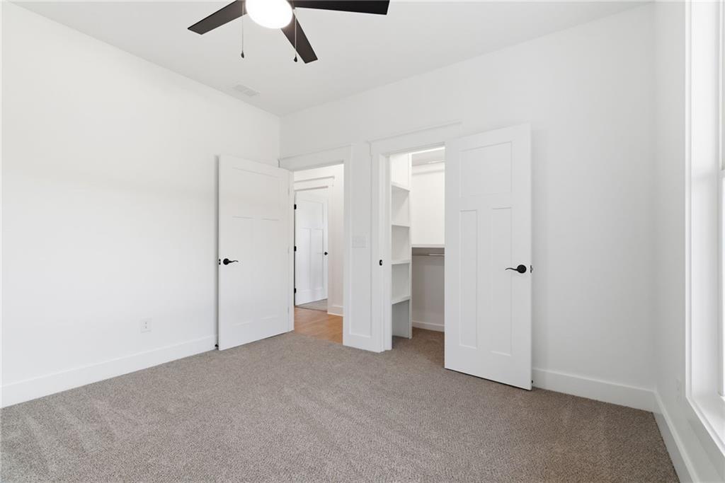 170 Field Stone Circle Jasper, GA 30143 - Photo 21 of 34 an empty room with a ceiling fan and shower